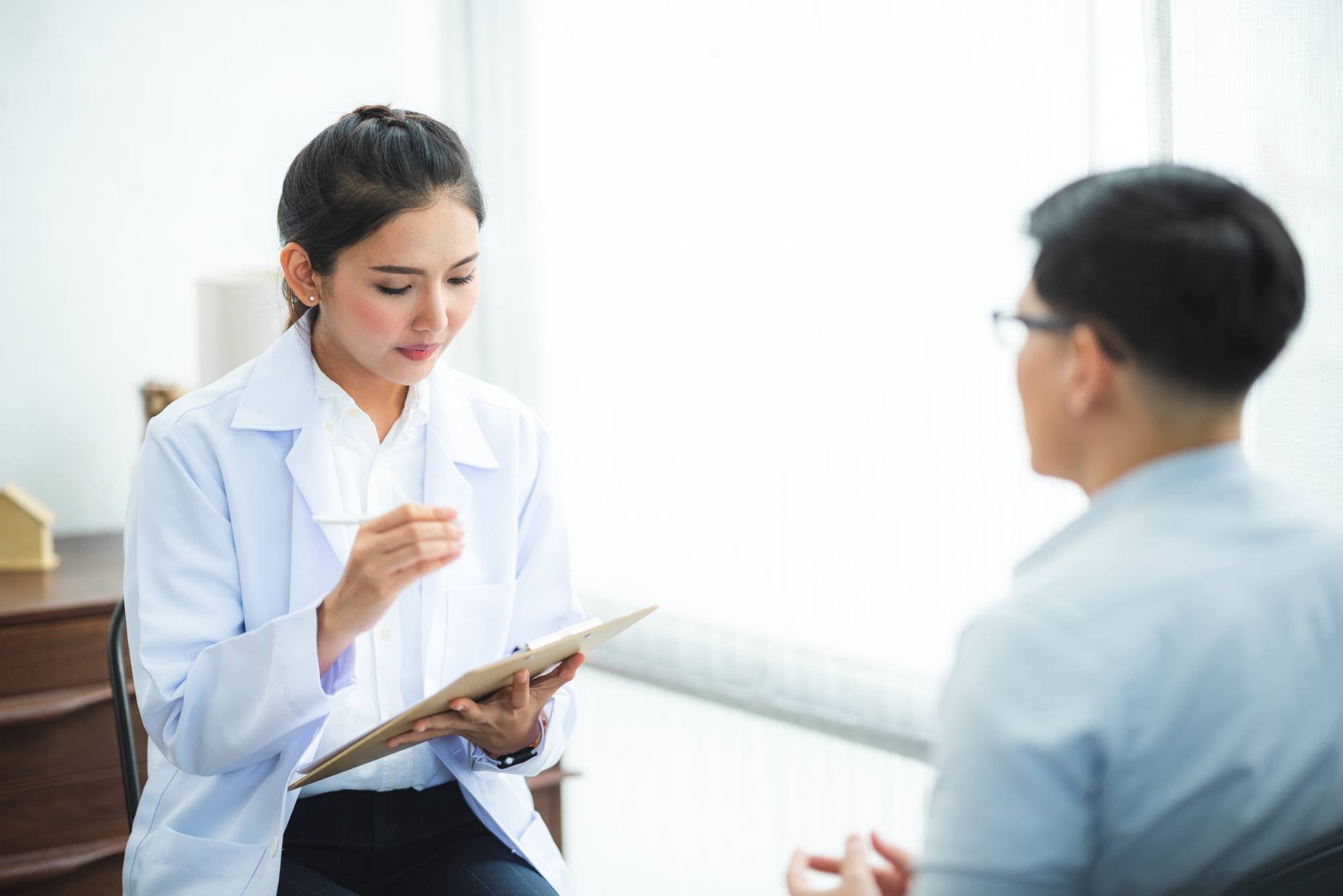 mental health nurse consultiung a patient
